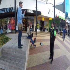 Man Warns People in Town Square