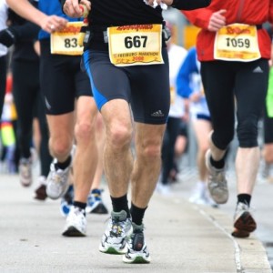 How can pronation cause hallux rigidus in a runner?