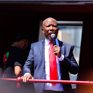 EFF Leader Julius Malema addressing EFF members outside the East London Magistrates Court.