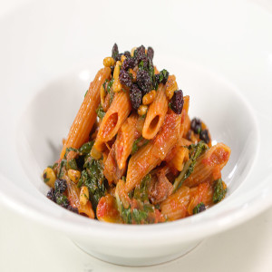 Red Lentil Penne Pasta with Chorizo, Sofrito, Pine Nuts and Currants