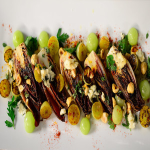 Charred Grape and Endive Salad with Roquefort, Hazelnuts and Black Pepper Honey
