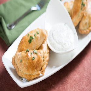 Empanadas with Black Beans, Pork, Pumpkin and Queso Anejo
