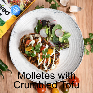 Molletes with Crumbled Tofu, Refried Black Beans, Salsa Fresca, and Crema