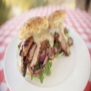 Pork Steak Biscuit with Beer-Cheese Sauce and Charred Red Onions