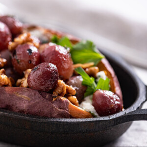 Baked Sweet Potato stuffed with Goat Cheese, Roasted Red Grapes, Walnuts and Thyme