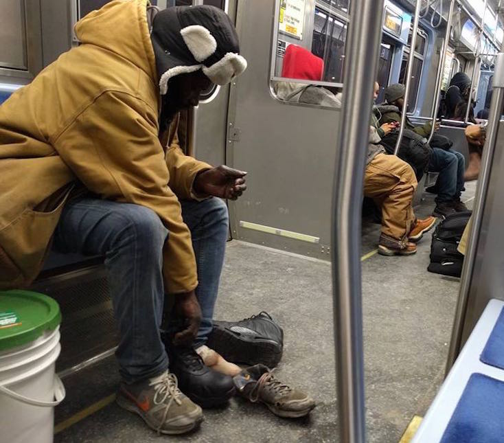 Stranger Gives Boots Off His Feet to Freezing Homeless Man on Subway