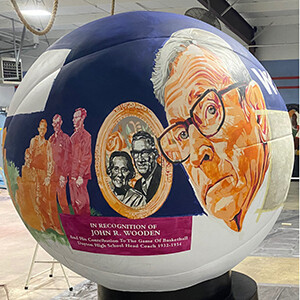 Huddling with the Indiana artists painting 24 massive basketballs for All-Star Weekend