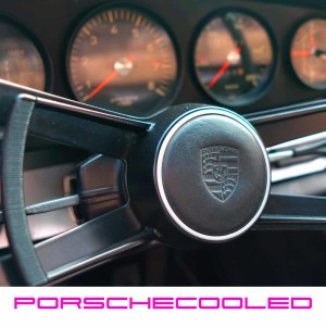 Porsche Chat with Flat Cap Driver