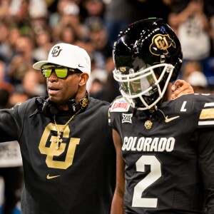 Deion 'Coach Prime' Sanders, Shedeur Sanders and Cam’Ron Silmon-Craig following Colorado’s loss to BYU in Alamo Bowl